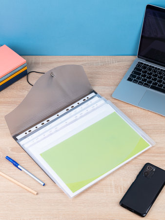 Transparent plastic office folder on wooden background. Office Folder Templateの写真素材