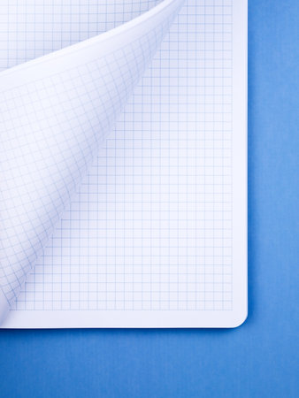 White paper sheet background isolated on blue, close upの写真素材