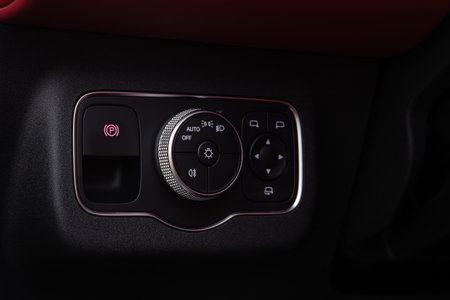 Novosibirsk, Russia - August 29, 2023: black EXEED RX, close-up of headlight buttons. modern car...