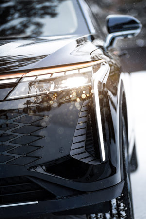 Mock-up, banner for car advertising. Black new car front view: xenon headlight, side mirror, bumper...