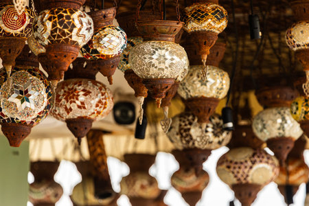 bright glass lamps in the market stall from the ceiling in a gift shop