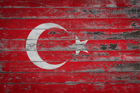 The national flag of Turkey is painted on uneven wooden boards. Country symbol.の写真素材