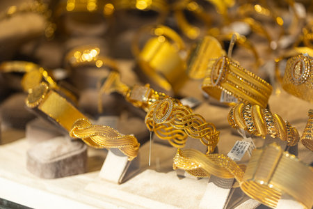 Jewelry shop window with a huge selection of gold jewelry bracelets, chains