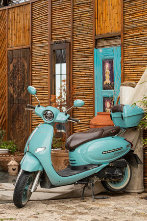 Side ; Turkey â February 04 2024: blue Arora Cappucino is parked on the street on a warm day against the backdrop of a cafeのeditorial素材