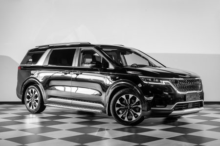 Novosibirsk, Russia - February 13, 2024: black Kia Carnival parked of a city. No other car and people.のeditorial素材