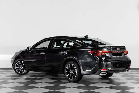 Novosibirsk, Russia - February 20, 2024: Toyota Avalon, parked against white wall, back viewのeditorial素材