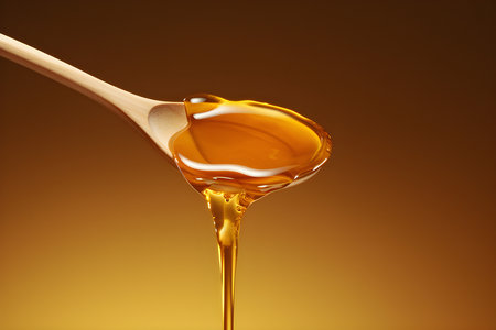 close-up of a wooden spoon with dripping honey on a light background, generated by AI. 3D illustrationの素材