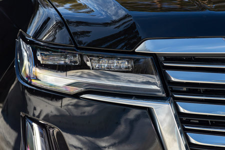 Novosibirsk, Russia - March 18, 2024 : Black Cadillac Escalade, Detail light close up of on new car....