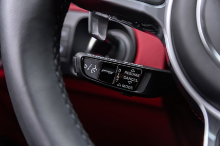 Novosibirsk, Russia - April 04, 2024: white Porsche Cayenne, Close up of car steering wheel with...