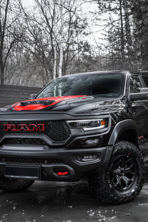 Novosibirsk, Russia - April 04, 2024: Black and Red Dodge Ram Trx, front view. Pick up; car in a...