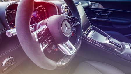 Novosibirsk, Russia - April 23, 2024 : silver Mercedes-Benz AMG GT 63 S 4MATIC, steering wheel with...
