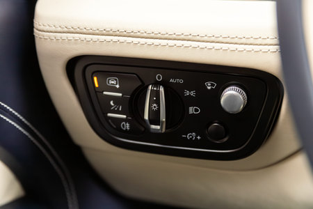 Novosibirsk, Russia - May 01, 2024: white Bentley Bentayga, close-up of headlight buttons on car...
