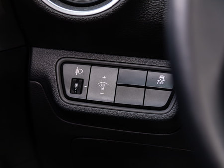 Novosibirsk, Russia - April 30, 2024: Kia K3, Close-up on the headlight switch control buttons,...