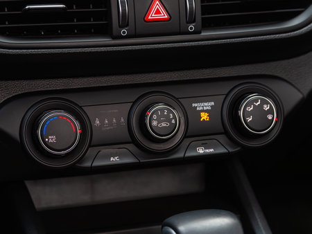 Novosibirsk, Russia - April 30, 2024: Kia K3, black car interior: climate control view with air...