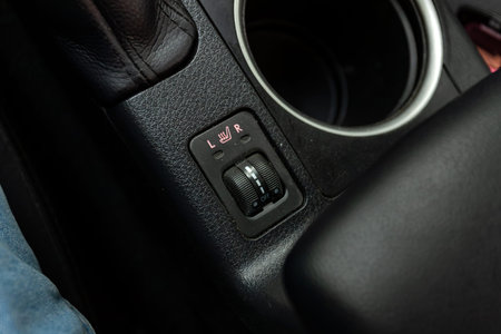 Novosibirsk, Russia - July 10, 2024: Subaru Legacy, close-up of seat heating buttons on car panel,...