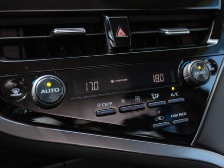 Novosibirsk, Russia - July 10, 2024: Toyota Camry , Buttons for turning on the car air conditioner...