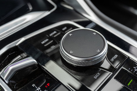 Novosibirsk, Russia - July 10, 2024: BMW X6, Close-up of the suspension control button, adjusting...