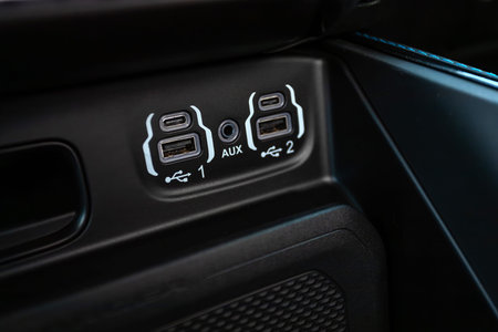Novosibirsk, Russia - July 10, 2024: RAM TRX Lunar Edition, Close up of a charging in the car, aux,...