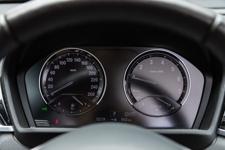 Novosibirsk, Russia - July 10, 2024: BMW X1 SDrive, Car panel, digital bright speedometer, odometer...
