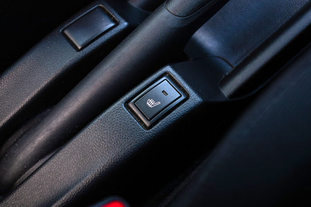 Novosibirsk, Russia - July 10, 2024: Suzuki Swift , Close up shot of car seat heating control panel