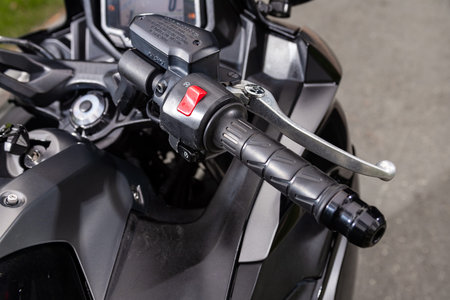 Novosibirsk, Russia - July 10, 2024:Kawasaki Ninja, close up of handle speed break part detail