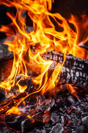 Close up of the hot charcoal glowing and flaming In fireplace. Glowing hot charcoal in barbecue...
