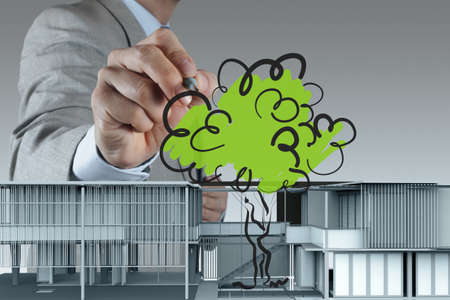 businessman draws building development conceptの写真素材