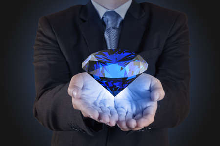 businessman hand show diamond as business chart conceptの写真素材
