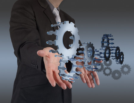 businessman hand show gear to success as concept