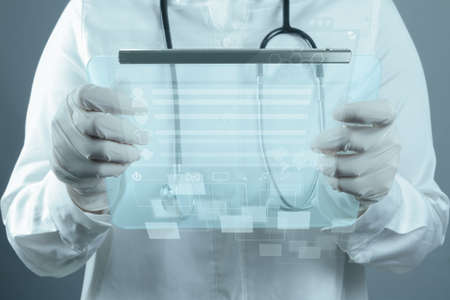 Medicine doctor working with modern computer interfaceの写真素材