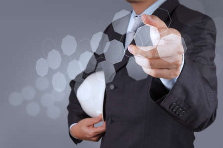 businessman hand using tablet computer and server room backgroundの写真素材