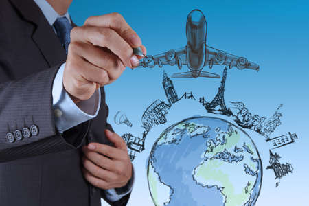 businessman hand draws airplane travel around the worldの写真素材