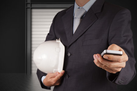 engineer businessman hand use smart phone computer with email icon