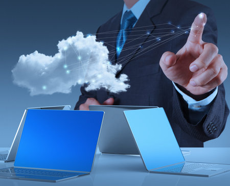 Businessman working with a Cloud Computing diagram on the new computer interface as concept