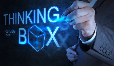 businessman hand draw thinking outside the box as conceptの写真素材