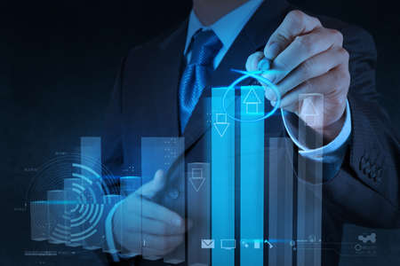 businessman hand drawing virtual chart business on touch screen computer businessman hand drawing virtual chart business on touch screen computer