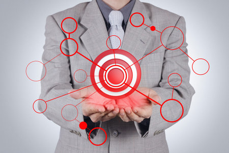 businessman hand shows target symbol as conceptの写真素材