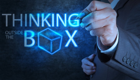 businessman hand draw thinking outside the box as concept