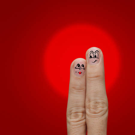 the happy couple in love with painted smiley and fall in loveの写真素材