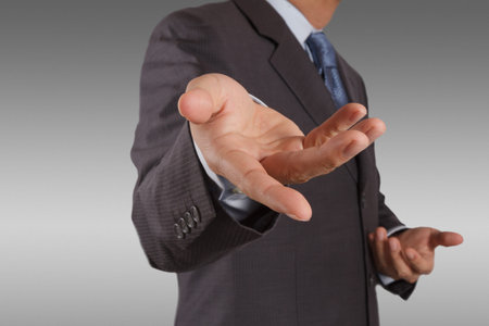  business man with an open hand as showing something concept