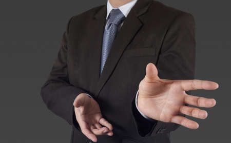  business man with an open hand as showing something conceptの写真素材