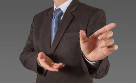Businessman hand pressing an imaginary button on virtual screenの写真素材