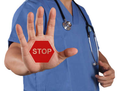 medical doctor hand surgeon shows stop sign with his hand as conceptの写真素材