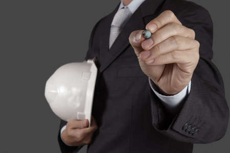 businessman hand writing in the whiteboard or virtual screenの写真素材