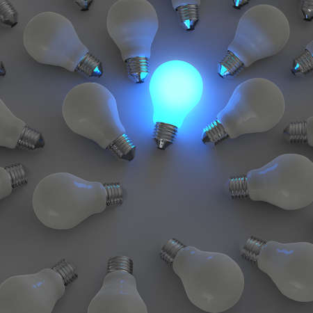3d growing light bulb standing out from the unlit incandescent bulbs as leadership conceptの写真素材