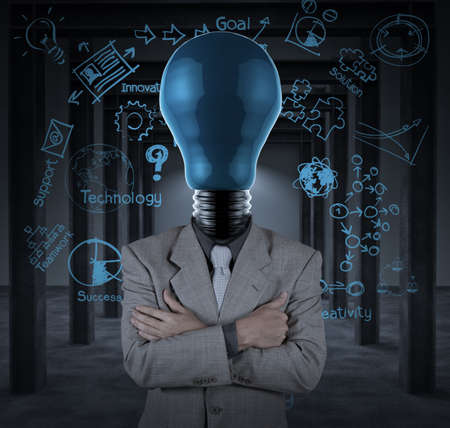 bulb headed businessman and business plan concept on wall background as conceptの写真素材