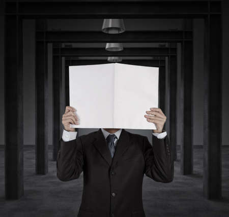 Businessman standing with on blank board as conceptの写真素材