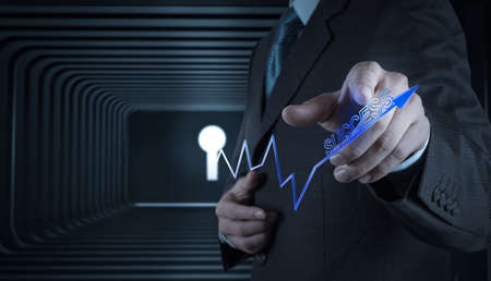 Businessman hand with  key to success as conceptの写真素材