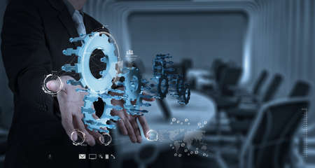 businessman hand draws gear to success conceptの写真素材