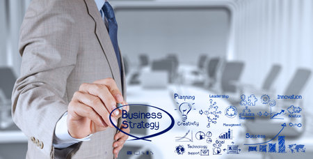 businessman hand working with new modern computer and business strategy as conceptの写真素材